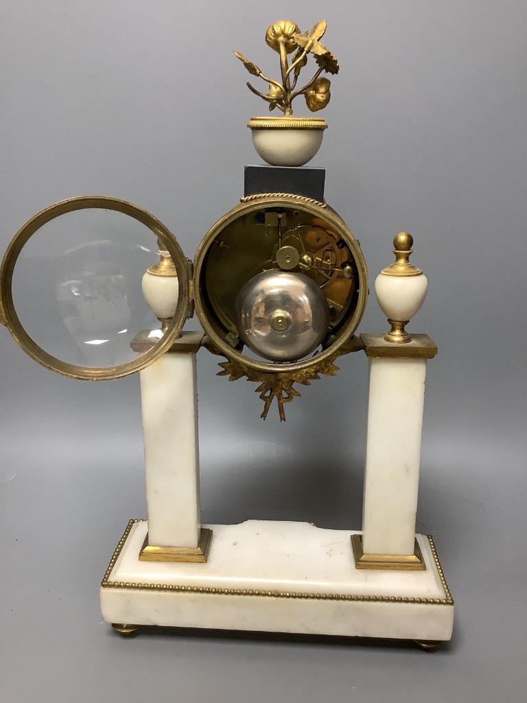 A French ormolu mounted and white marble clock garniture, c.1900, height 40cm